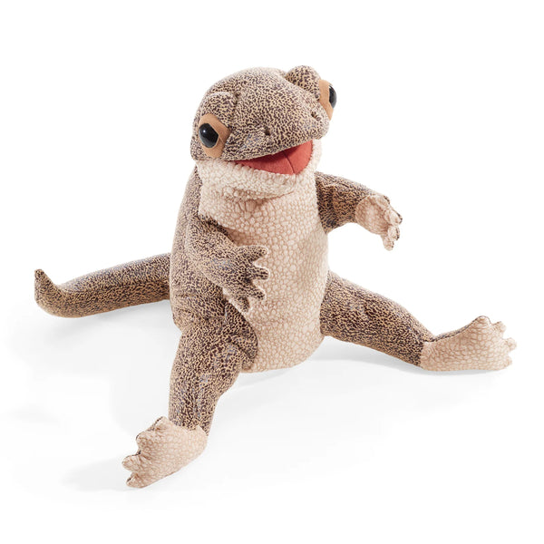 Plush toy lizard on a white background