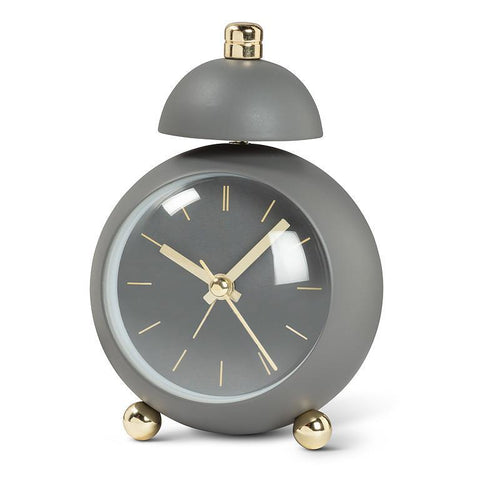Gray alarm clock with gold accents on a white background
