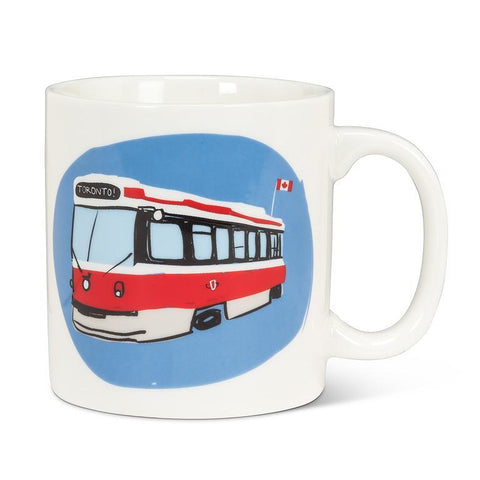 White mug with a red and white bus design on a blue background