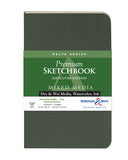 A Delta Series Premium Sketchbook in a dark charcoal gray-green cover, featuring a green and white paper label with product details and the Stillman & Birn logo.