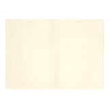 Lined cream-colored notebook on a white background