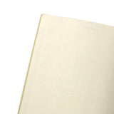 Close-up of a beige notebook with on a white background