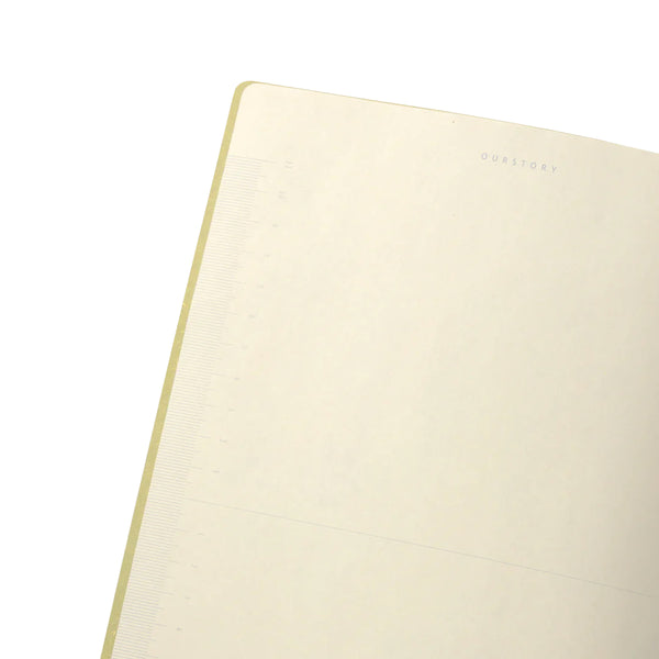 Close-up of a beige notebook with on a white background