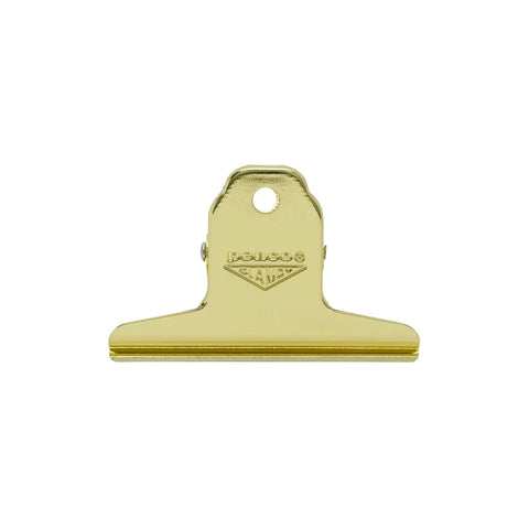 A gold-finished metal spring clip with a hanging loop and an embossed 'PENCO CLAMPY' logo, shown against a plain white background.