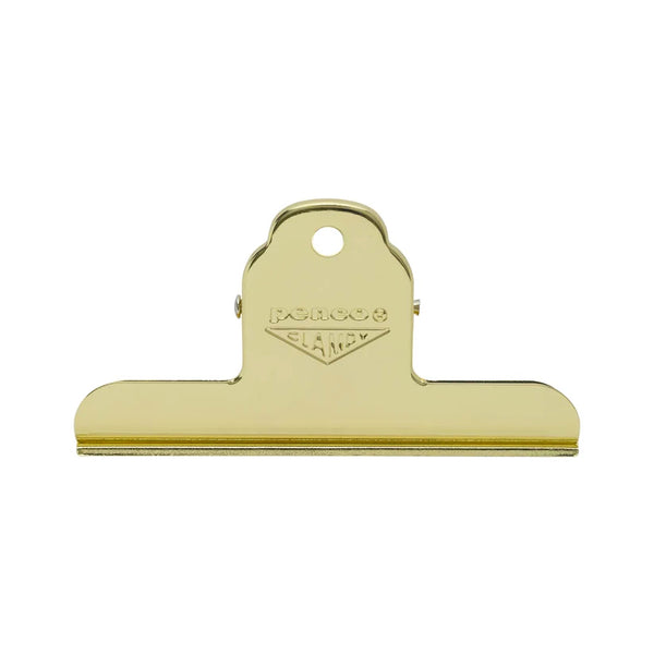 A gold-colored metal clipboard clip with a hanging loop and the brand name 'PENCO CLAMPY' embossed on the top, shown against a plain white background.